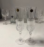 Two Cristal d'Arques flutes, goblet, tumblers, vase grouped