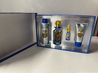 Open gift box showing four Villain items seated in tray