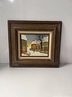 Full view of framed painting showing image and frame