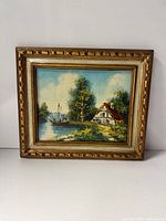 Front view of framed oil painting