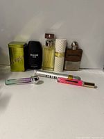 Group shot of all nine perfume bottles and rollerballs