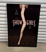 Front view of framed Showgirls poster