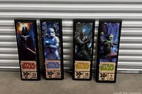 All four framed Star Wars prints lined up