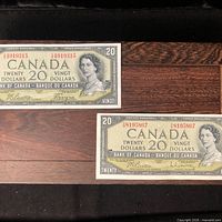 Obverse of both $20 banknotes showing serial numbers and portraits