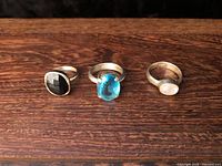 Front view of three sterling silver gemstone rings