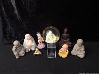 All nine figurines displayed against black background