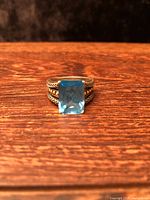 front view showing blue topaz and triple rope shank