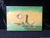 Top view of box showing painted boat scene