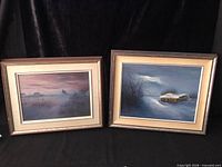 Both framed paintings side by side