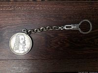 Full view of keychain with medal and chain links