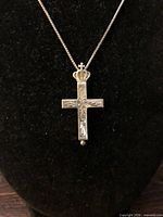 Front view of sterling crowned crucifix pendant on chain