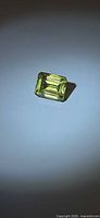 Emerald-cut lemon citrine front view under lighting
