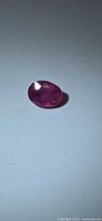 Oval pink faceted sapphire front view