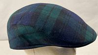 Side profile of Black Watch tartan flat cap