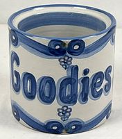 Front view showing "Goodies" script and blue band decoration