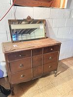 Full view of mirror atop dresser showing overall size and attached thermometer