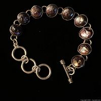 Close view of bracelet showing coin pearls and toggle clasp