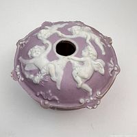 Top view showing cherub relief and central slot