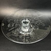 Top view showing pressed floral pattern and central hole