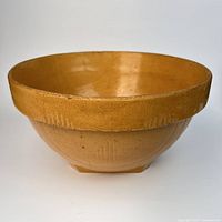 Overall view of yellow ware bowl showing shape and color