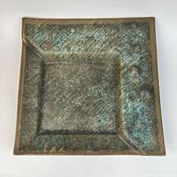 Top view showing square shape, patinated glaze, recessed center, raised bubbles