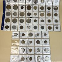 Overall view of three filled plastic token sleeves