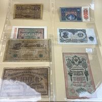 Six banknotes in plastic page, fronts visible