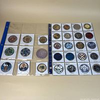 Two binder sleeves showing all 29 tokens