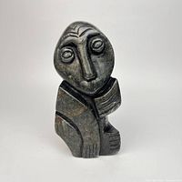 Front view of dark soapstone Shona figure sculpture