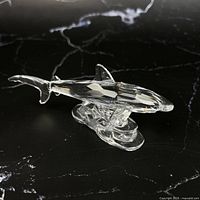 right side view of crystal shark on wave stand