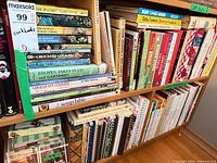 Shelf of assorted cookbooks and booklets