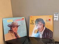 Both sealed Elvis Presley LPs side by side