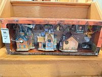 Front of boxed Holiday Time Thanksgiving 10-piece village set