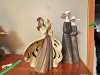 Lot overview showing both Lladró figurines on shelf