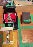 Bulova Accutron watch in presentation case, Caravelle box, additional Pulsar box visible