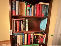 Full bookshelf showing majority of assorted books