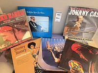 Group shot of multiple LPs showing visible titles and sleeve condition