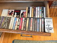 Drawer showing a row of cassette tapes with assorted titles
