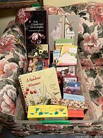 Plastic bin containing multiple boxed greeting/note card sets and organizer