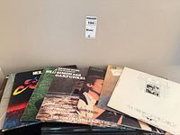 Stack of LPs showing five front covers