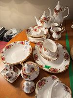 Group view of Royal Albert Old Country Roses dinnerware pieces on table
