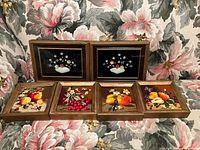 Front view of all six framed artworks showing designs and frames