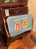 Exterior of blue Skipper & Skooter carry case showing graphics, handle and clasp