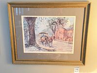 Framed print hung on wall showing artwork, mat and frame