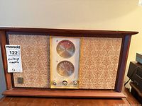 Front view showing grille, dials and controls