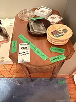 Top of humidor with coasters, ashtrays and ceramic boxes