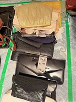 Stack of multiple clutches showing variety of textures and colors