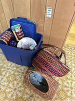 Overview of blue tote with tins and baskets