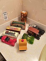 Overview of nine Avon novelty aftershave bottles and three boxes