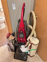 Overview of Bissell carpet cleaner, Electrolux canister vacuum and Shark handheld vacuum box